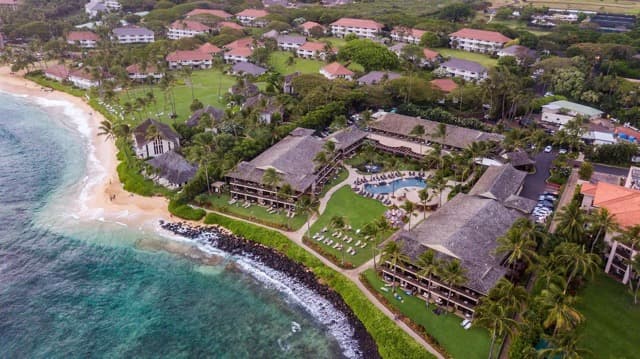 Kauai resort pool surrounded by tropical gardens near Poipu